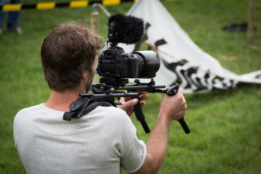 man making video with DSLR